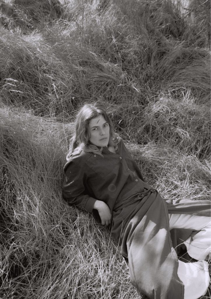 Lieke Dijkstra (loki) lying in grass